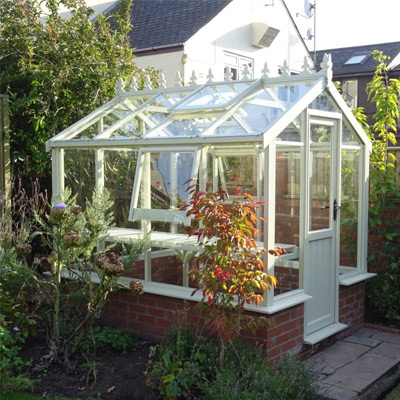 6x4 white dwarf wall greenhouse in garden