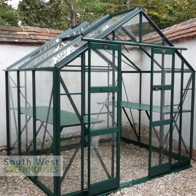 green aluminium 8x6 greenhouse with toughened glass in garden