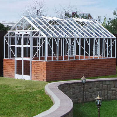 white dwarf wall aluminium greenhouse in garden