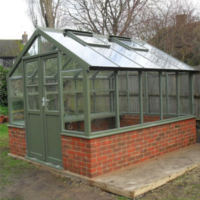 large dwarf wall greenhouse in green