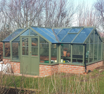 large t-shaped wooden greenhouse