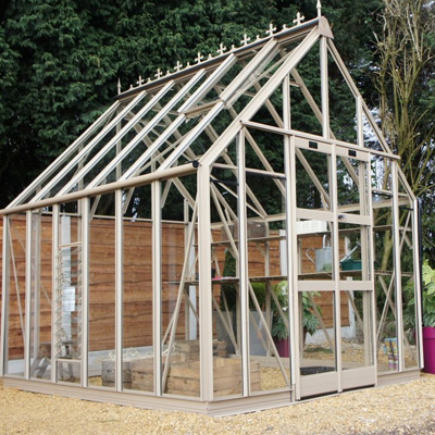 grey coloured aluminium victorian greenhouse on gravel