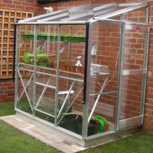 aluminium lean to greenhouse in garden