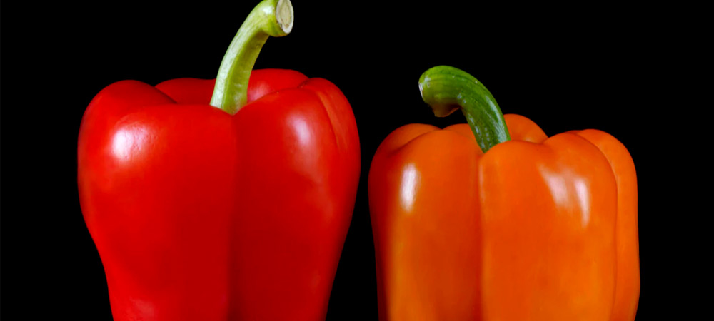 red pepper next to orange pepper