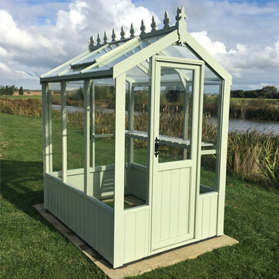small wooden greenhouse with duck egg green finish